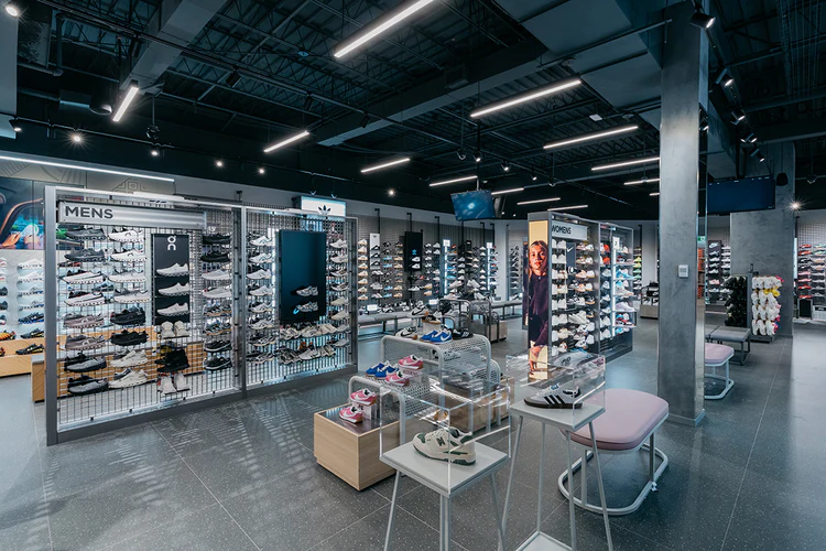 Interior of the JD Sports Square One store, with retail fixtures and exposed ceiling systems.